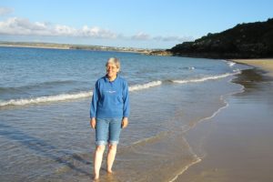 Caroline paddling in the Atlantic at St Ives