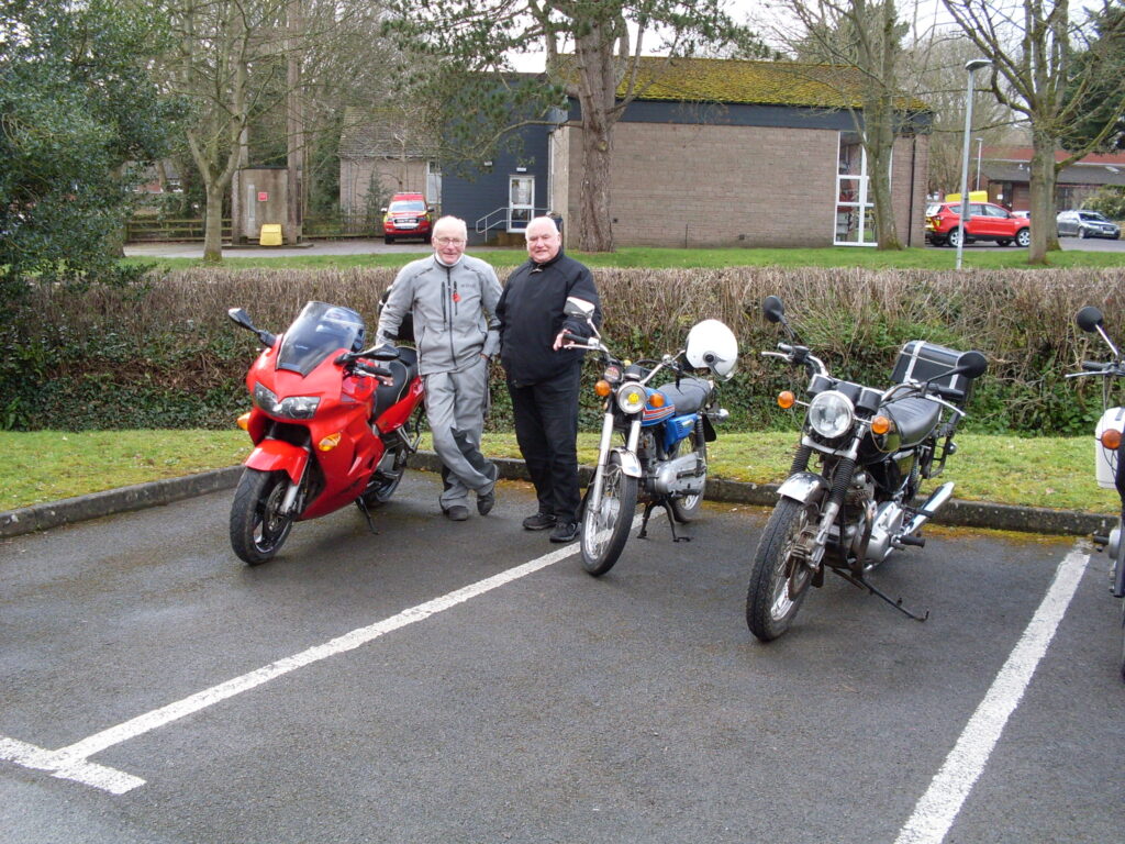 Two happy gents...and a few red vehicles!