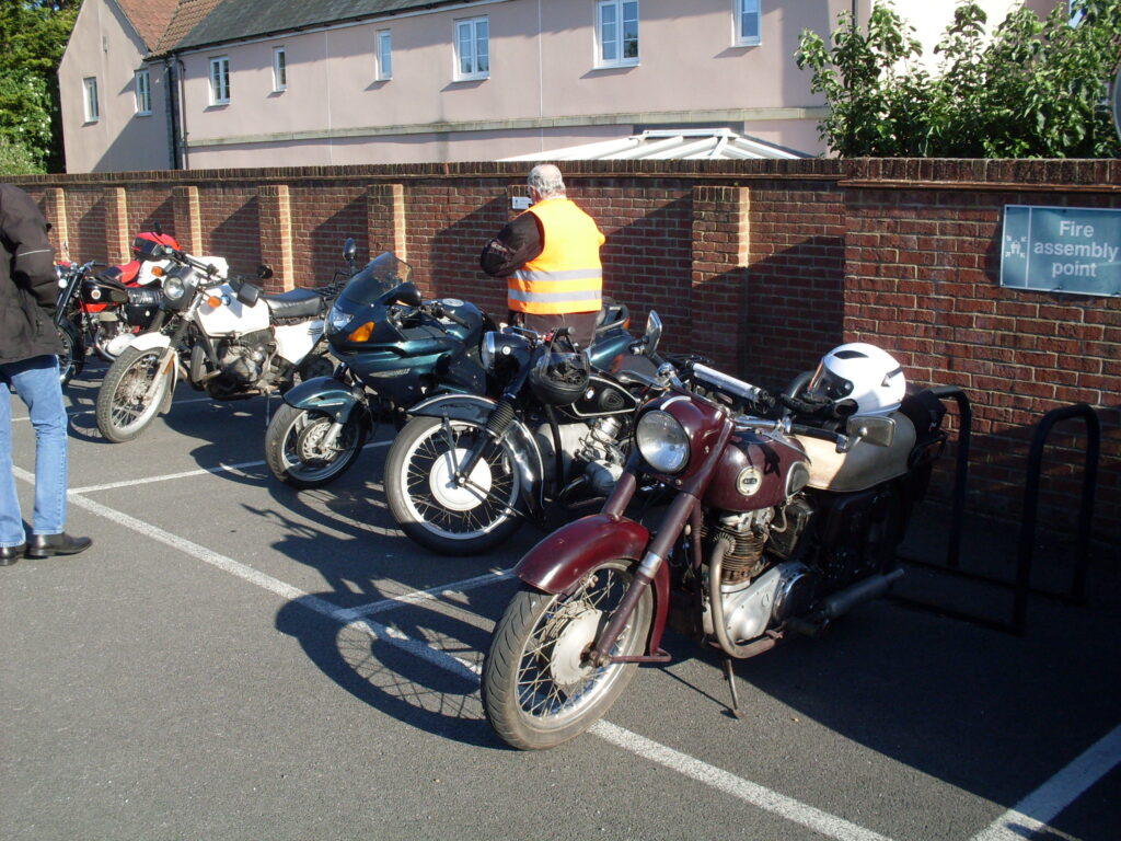 A varied line up of motorbikes, the first four of which are twin-cylindered