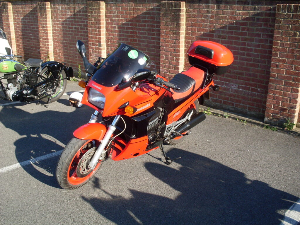 A Kawasaki motorbike, but it's painted red not the usual green.